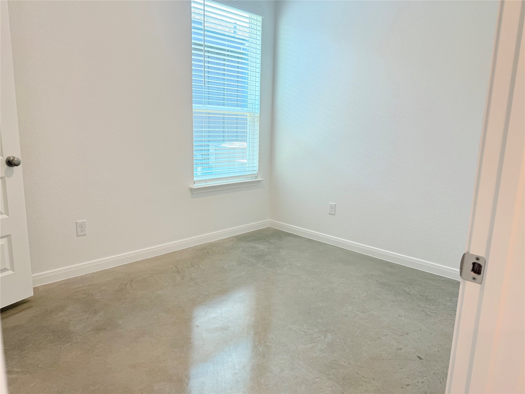 2909 Quail Rdg Lane, Unit A Temple, TX 76501 - Photo 14 of 19 Empty room with concrete floors and baseboards
