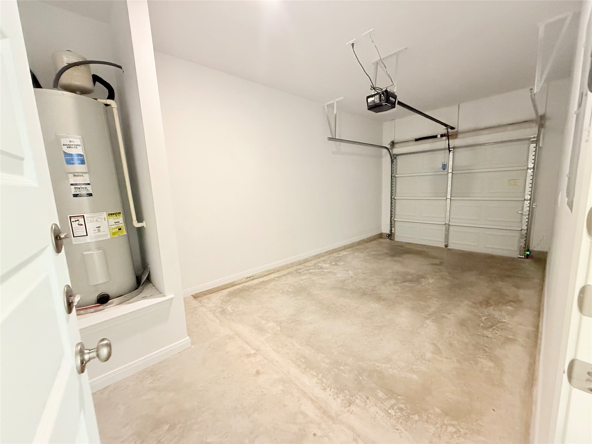 2909 Quail Rdg Lane, Unit A Temple, TX 76501 - Photo 16 of 19 Garage featuring electric water heater and a garage door opener