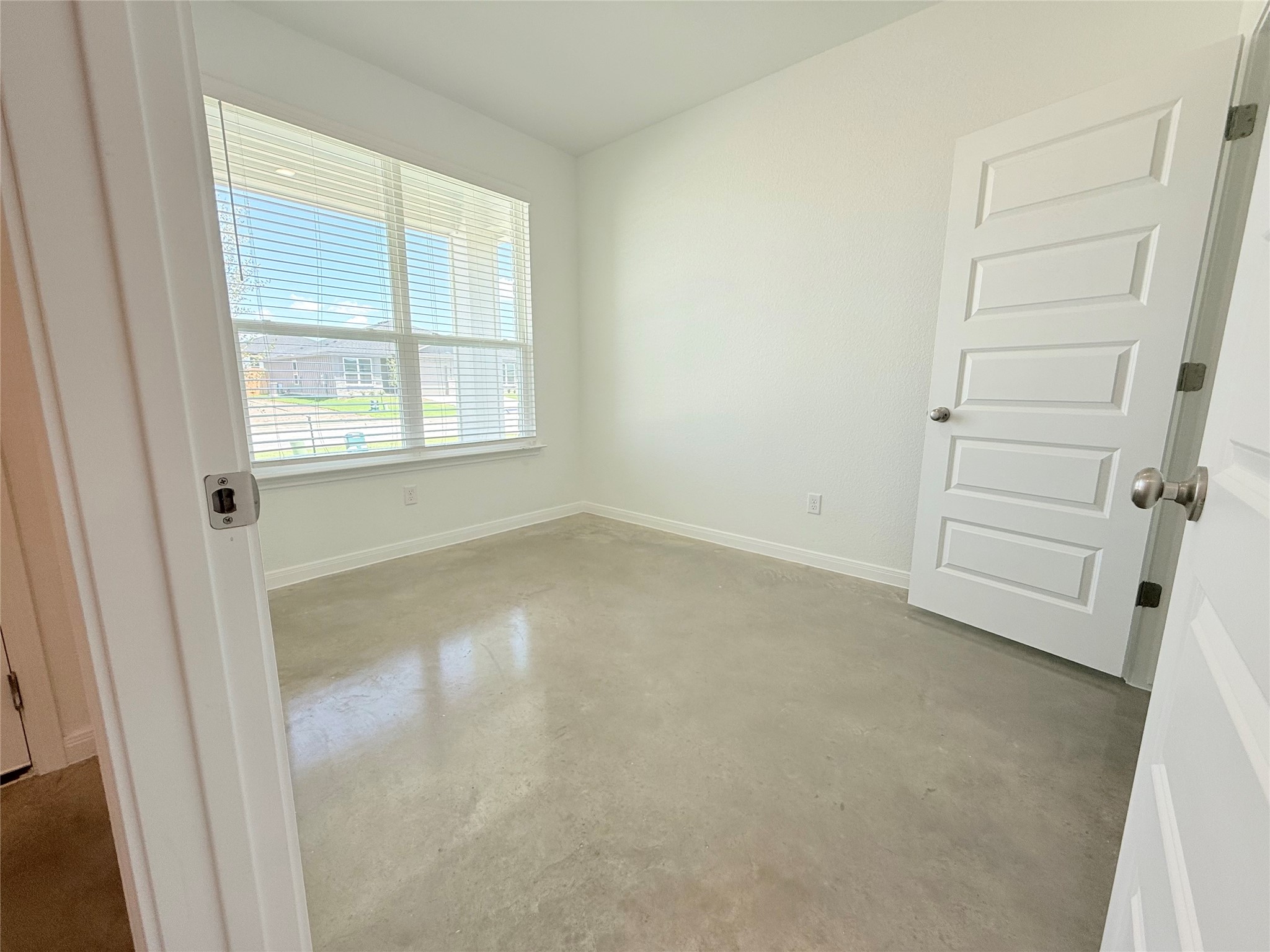 2909 Quail Rdg Lane, Unit A Temple, TX 76501 - Photo 18 of 19 Spare room featuring concrete flooring and baseboards