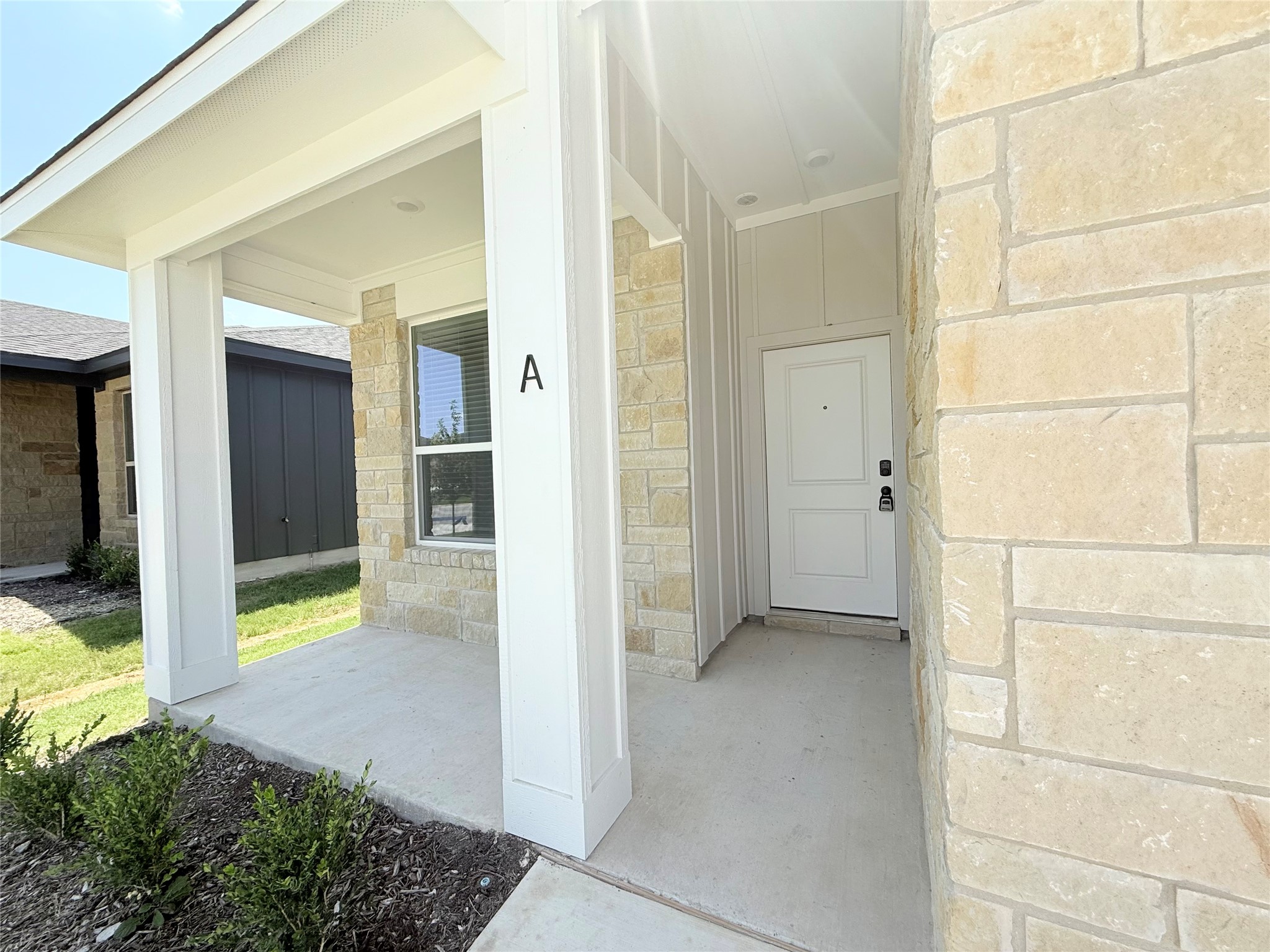 2909 Quail Rdg Lane, Unit A Temple, TX 76501 - Photo 2 of 19 Property entrance featuring covered porch, stone siding, and board and batten siding