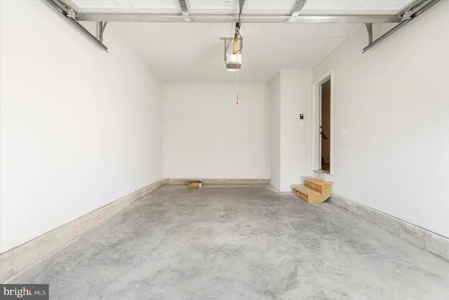 a view of an empty room with wooden roof