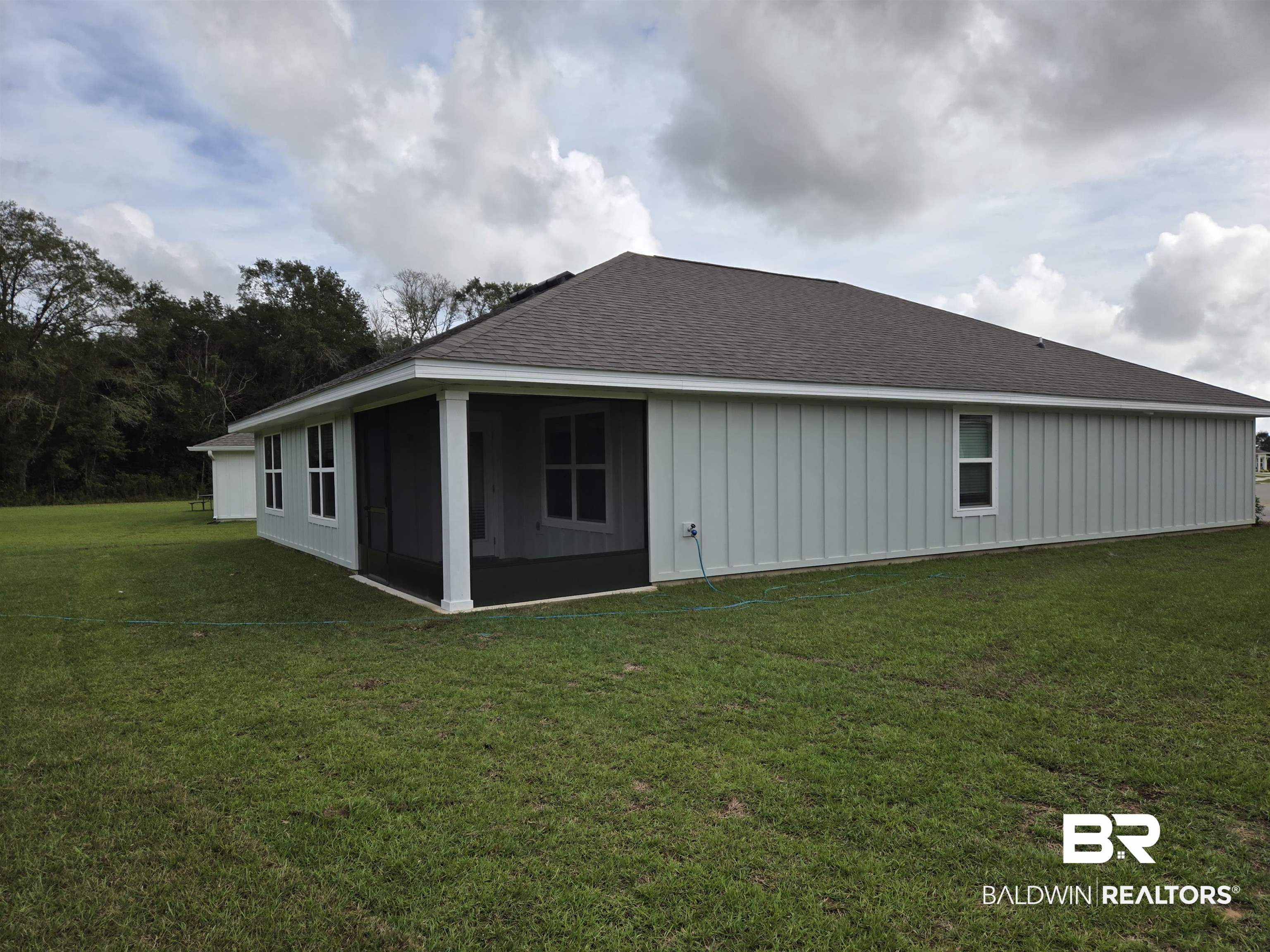 24194 Veranda Circle Elberta, AL 36530 - Photo 30 of 31 Rear view of property featuring a sunroom and a yard