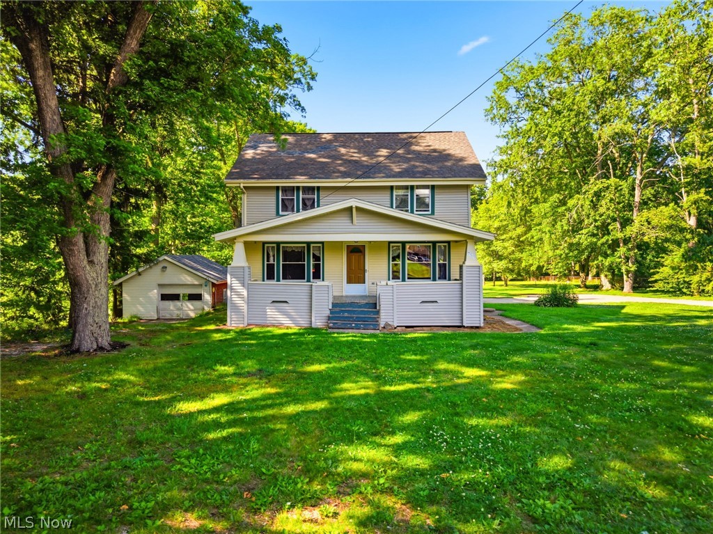 759 Runkle Avenue Ashtabula, OH 44004 - Photo 2 of 40 Two-story residence with a covered front porch and tan siding