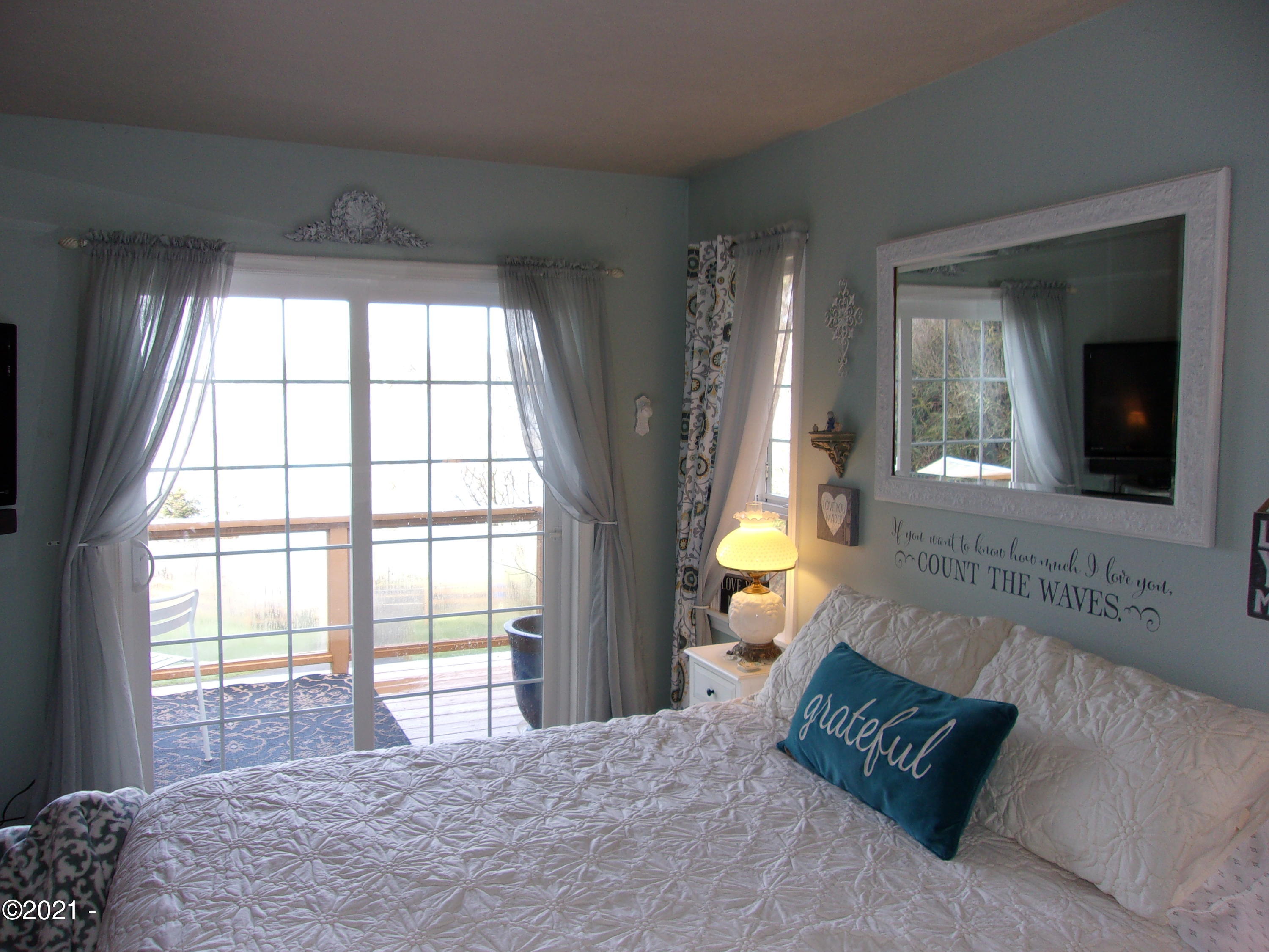 3065 Yaquina Bay Road Newport, OR 97365 - Photo 21 of 32 Master w/slider to Bay View Deck
