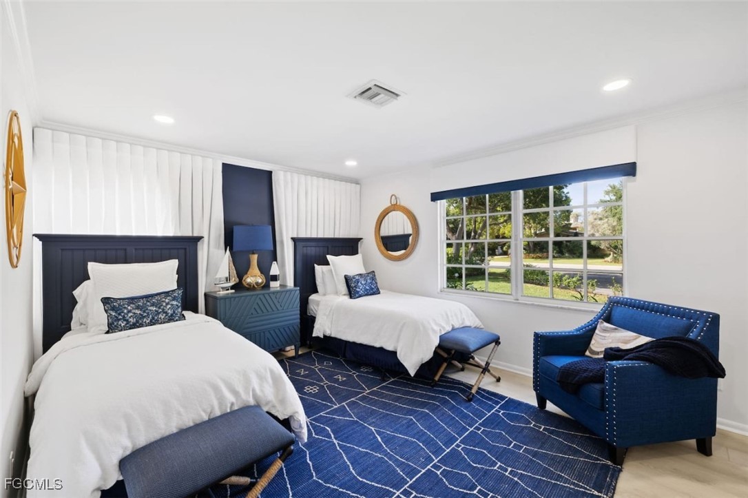 2728 Crayton Road Naples, FL 34103 - Photo 21 of 35 a bed room with bed and a window