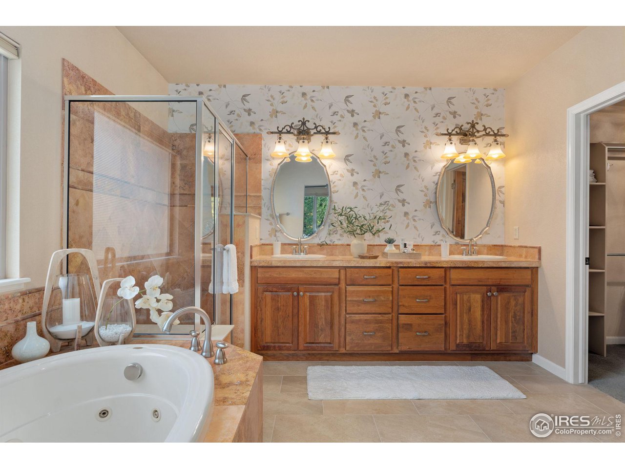 6511 Half Moon Bay Drive Windsor, CO 80550 - Photo 13 of 31 a bathroom with a sink double vanity and a mirror