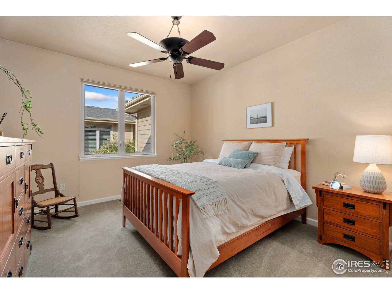 6511 Half Moon Bay Drive Windsor, CO 80550 - Photo 14 of 31 a bedroom with a bed and a window
