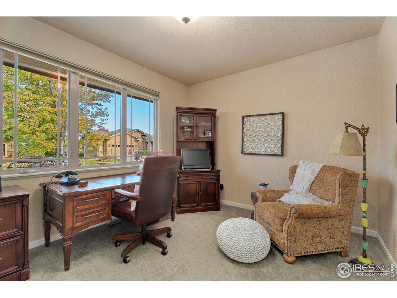 6511 Half Moon Bay Drive Windsor, CO 80550 - Photo 4 of 31 a living room with furniture and a large window