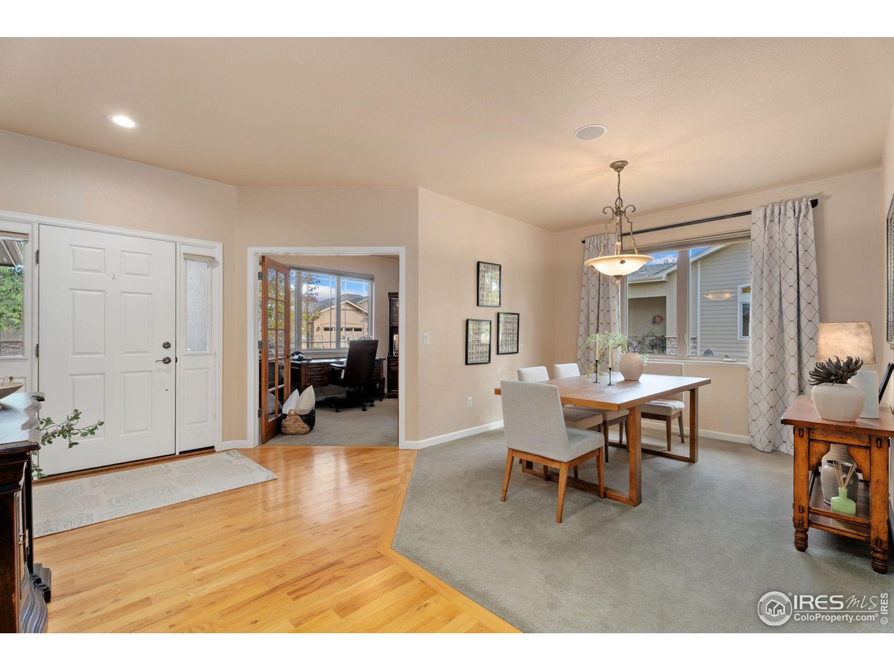 6511 Half Moon Bay Drive Windsor, CO 80550 - Photo 5 of 31 a dining room with furniture and wooden floor