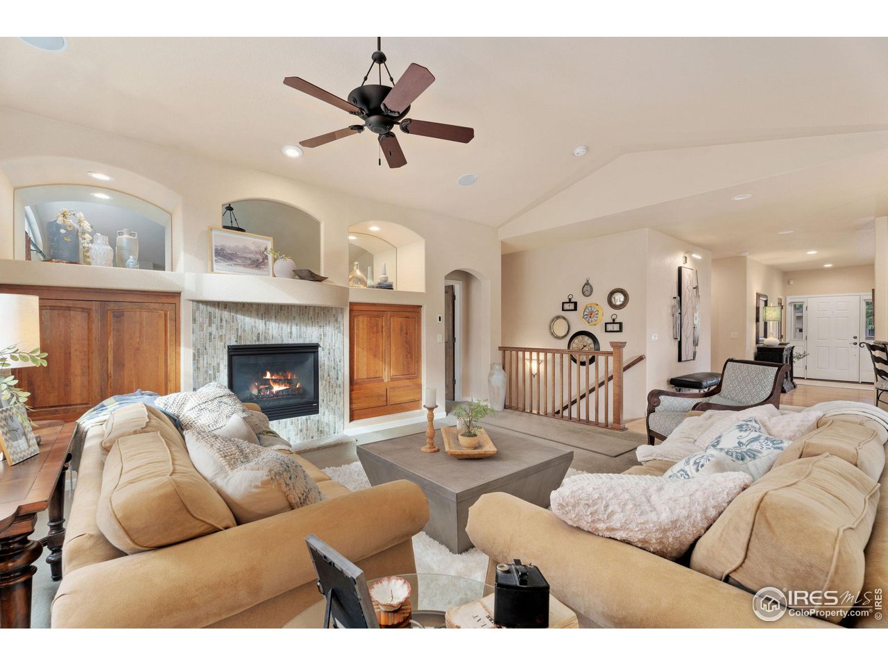 6511 Half Moon Bay Drive Windsor, CO 80550 - Photo 8 of 31 a living room with furniture and a fireplace