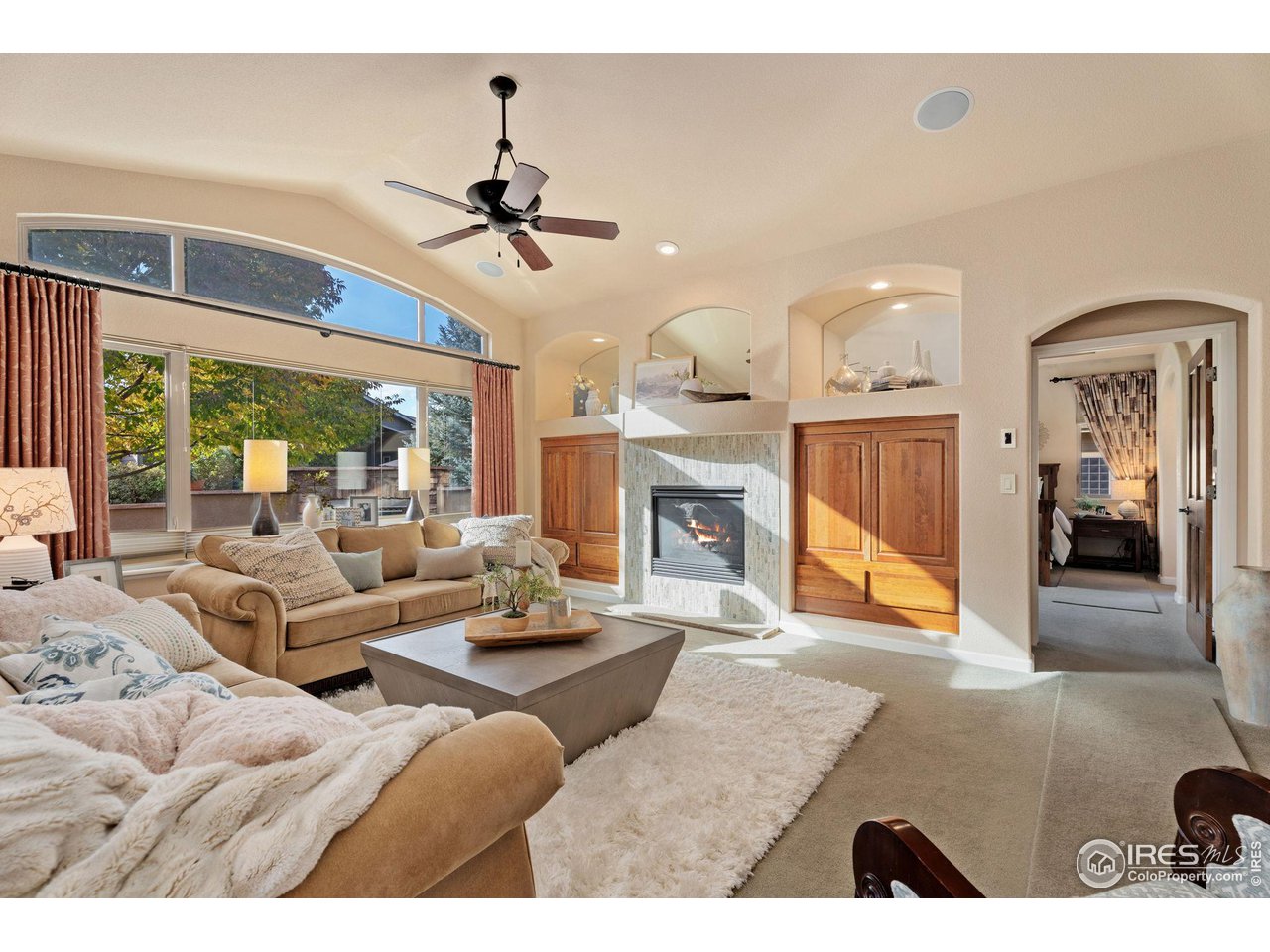 6511 Half Moon Bay Drive Windsor, CO 80550 - Photo 9 of 31 a living room with furniture and a fireplace