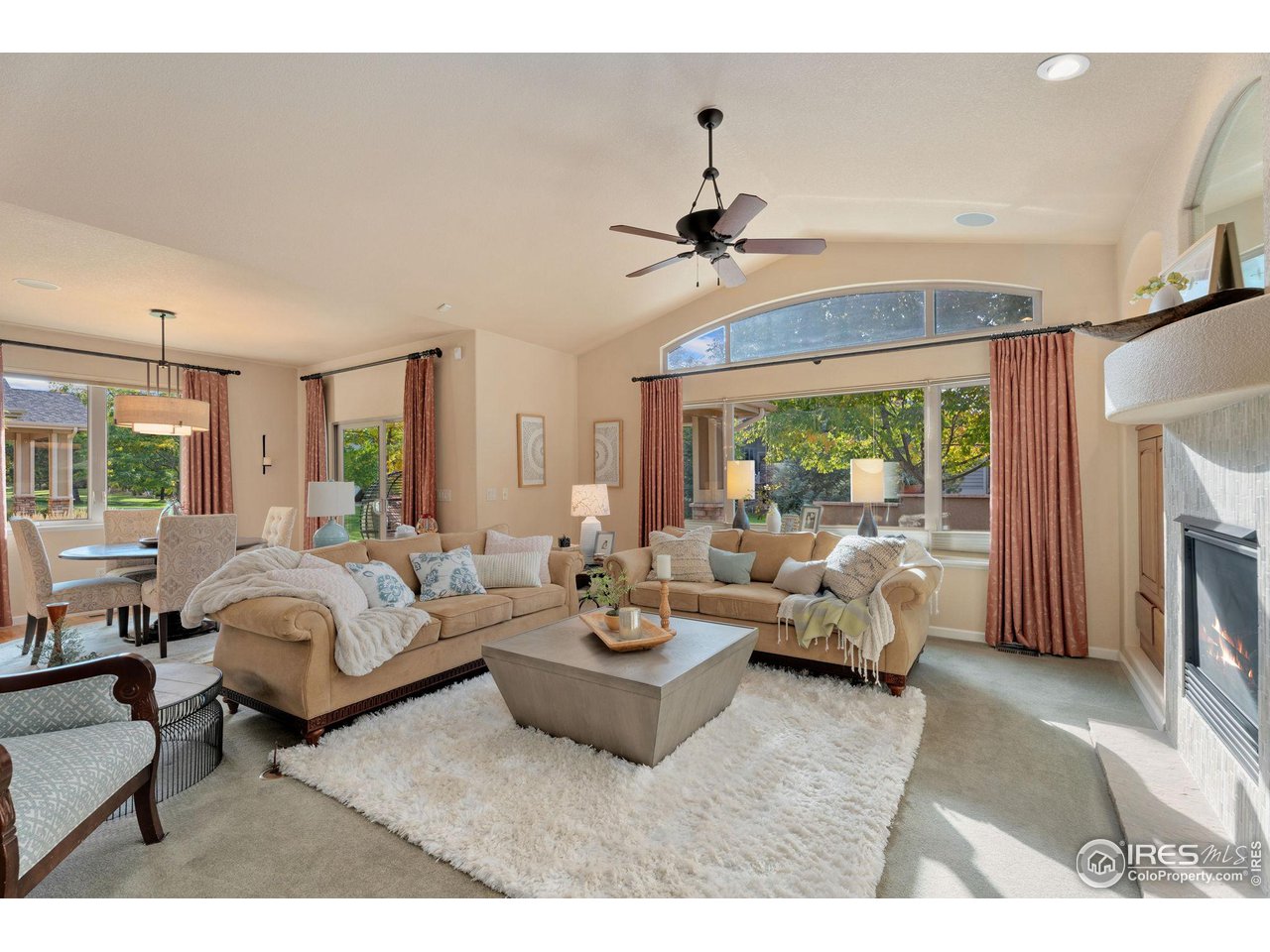 6511 Half Moon Bay Drive Windsor, CO 80550 - Photo 10 of 31 a living room with furniture and a large window