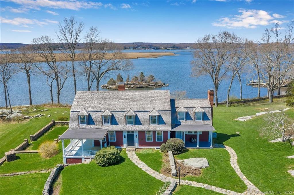 17 Tantummaheag Road Old Lyme, CT 06371 - Photo 1 of 1 an aerial view of a house with a garden and lake view