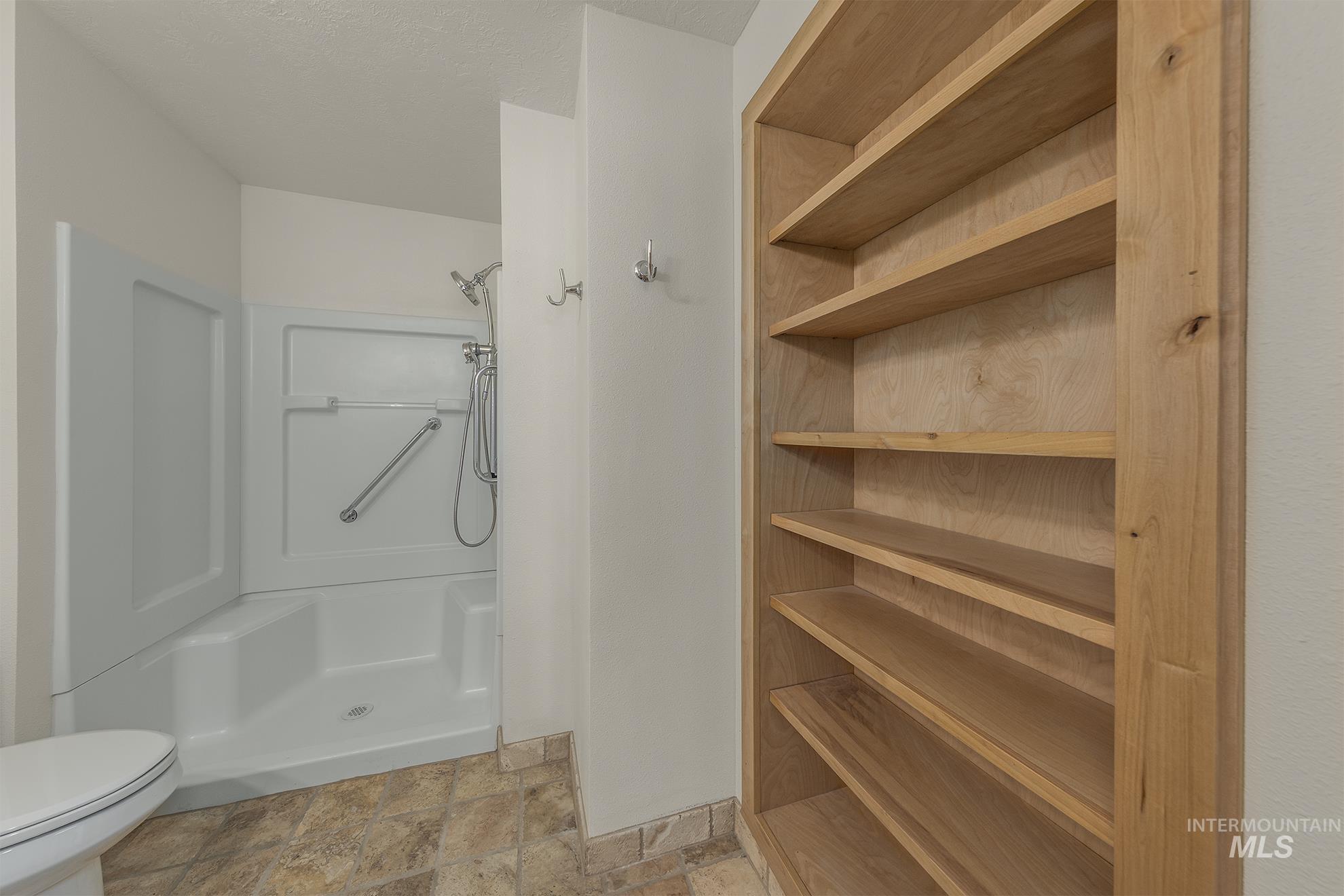 327 Macomb Road Weiser, ID 83672 - Photo 18 of 49 Full bath featuring a stall shower and light stone finish flooring