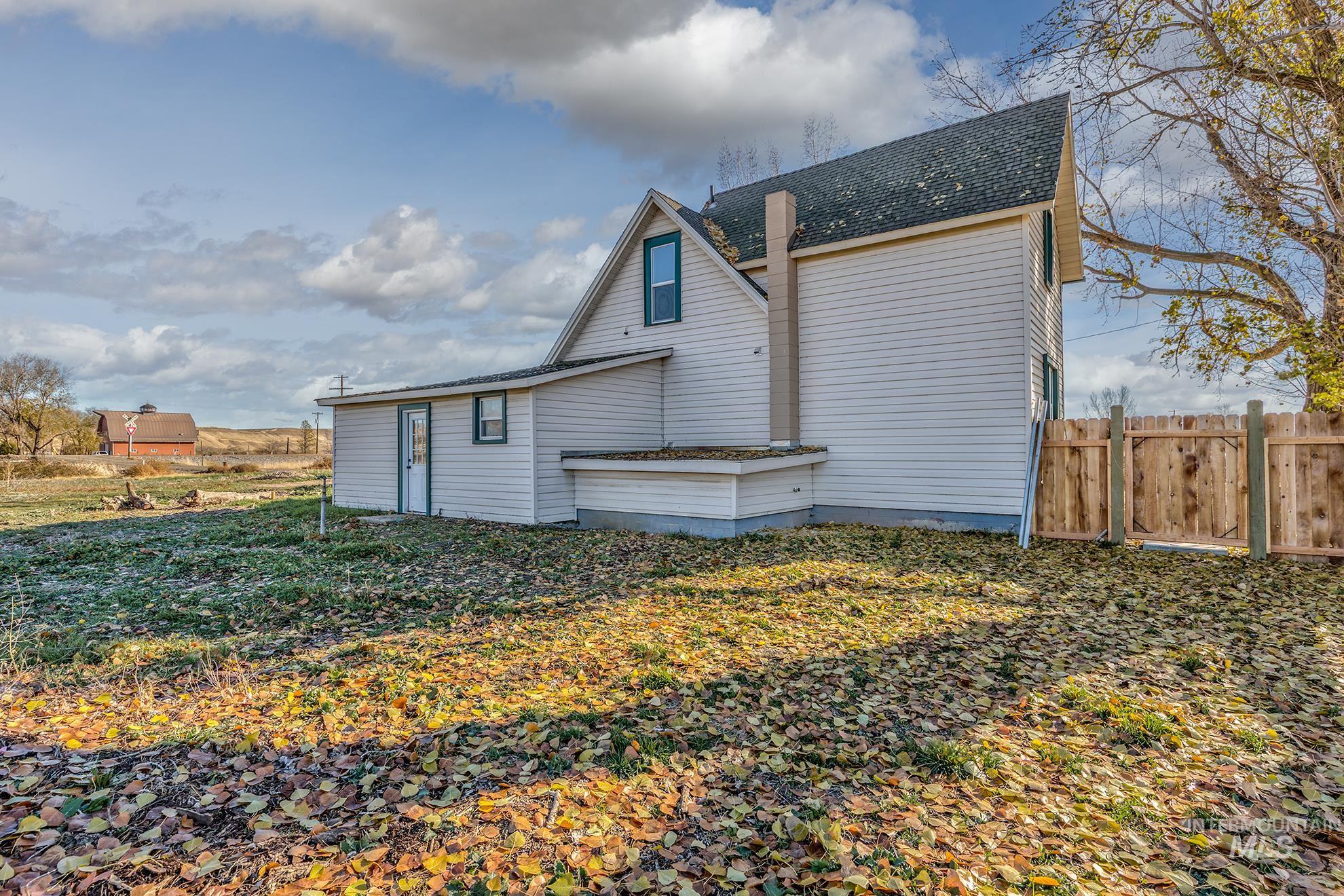 327 Macomb Road Weiser, ID 83672 - Photo 42 of 49 Rear view of property with roof with shingles