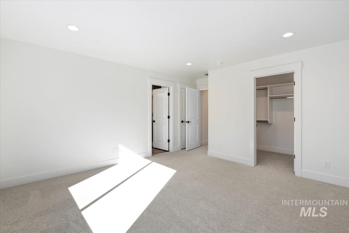 752 South Calhoun Lane Star, ID 83669 - Photo 27 of 45 Bright interior space featuring light-colored carpeting and white walls