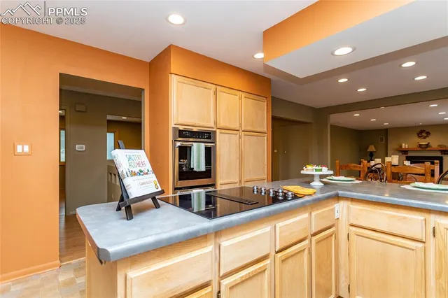 a kitchen with a sink cabinets and window