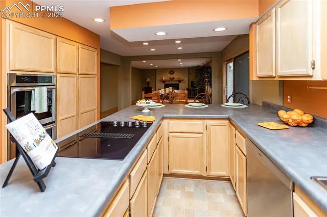 a kitchen with a sink appliances and cabinets
