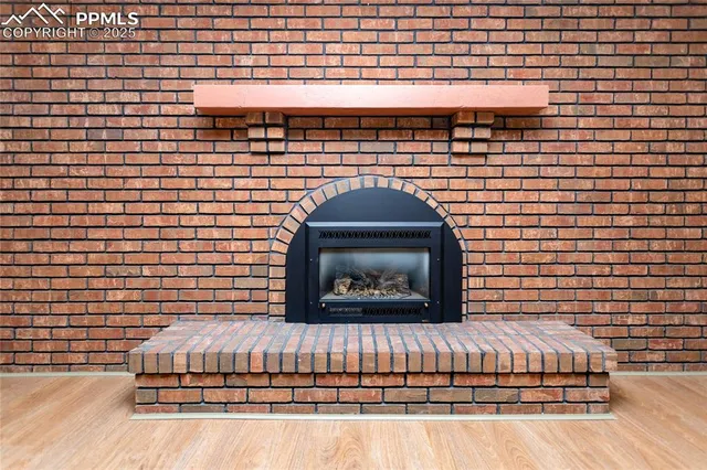 an empty room with closet and windows