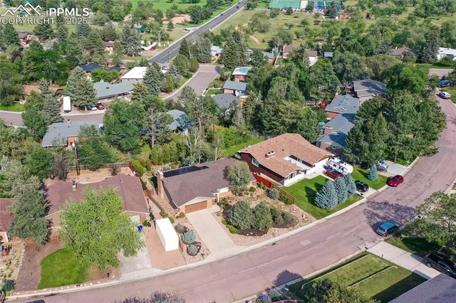 an aerial view of residential house and green space