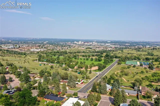 an aerial view of residential house and green space