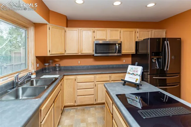 a kitchen with sink and window