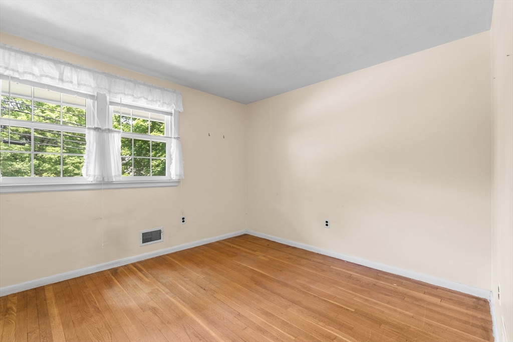 348 Belknap Road Framingham, MA 01701 - Photo 17 of 35 a view of empty room with wooden floor and fan
