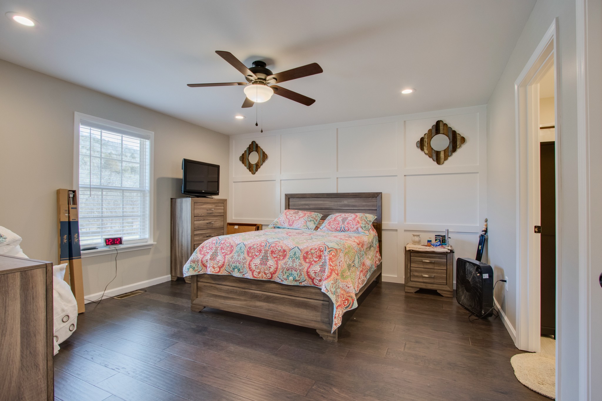 20 Young Road Buffalo Valley, TN 38548 - Photo 17 of 28 a bedroom with a bed and a chandelier