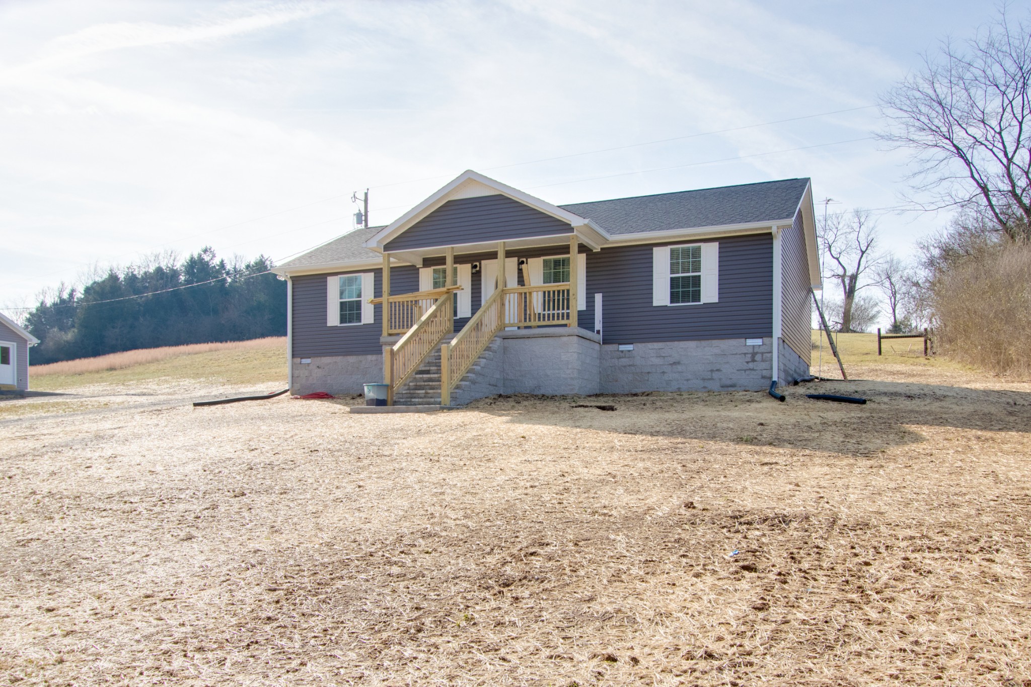 20 Young Road Buffalo Valley, TN 38548 - Photo 3 of 28 a front view of a house with a yard