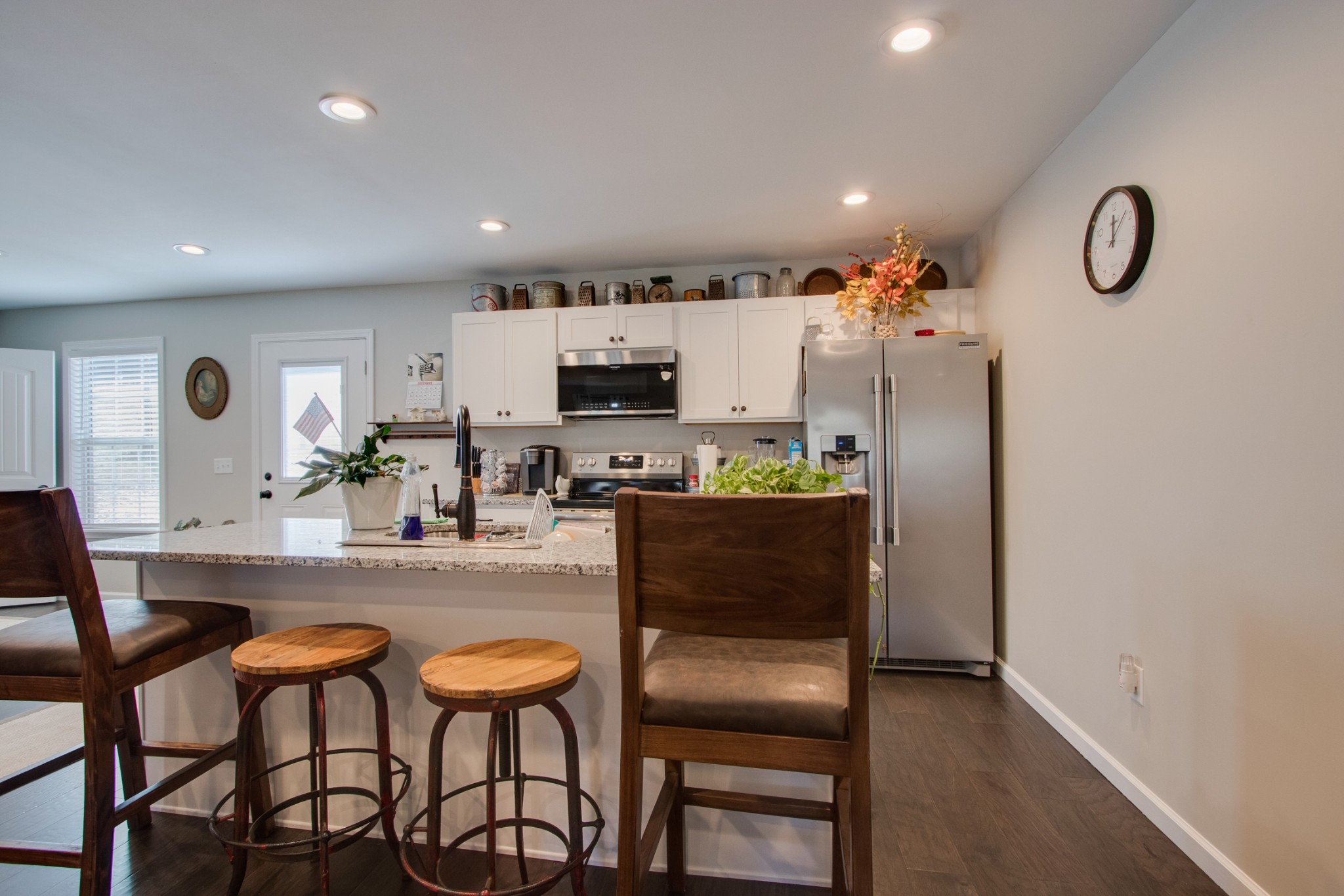 20 Young Road Buffalo Valley, TN 38548 - Photo 10 of 28 a kitchen with stainless steel appliances kitchen island granite countertop a dining table chairs and a refrigerator