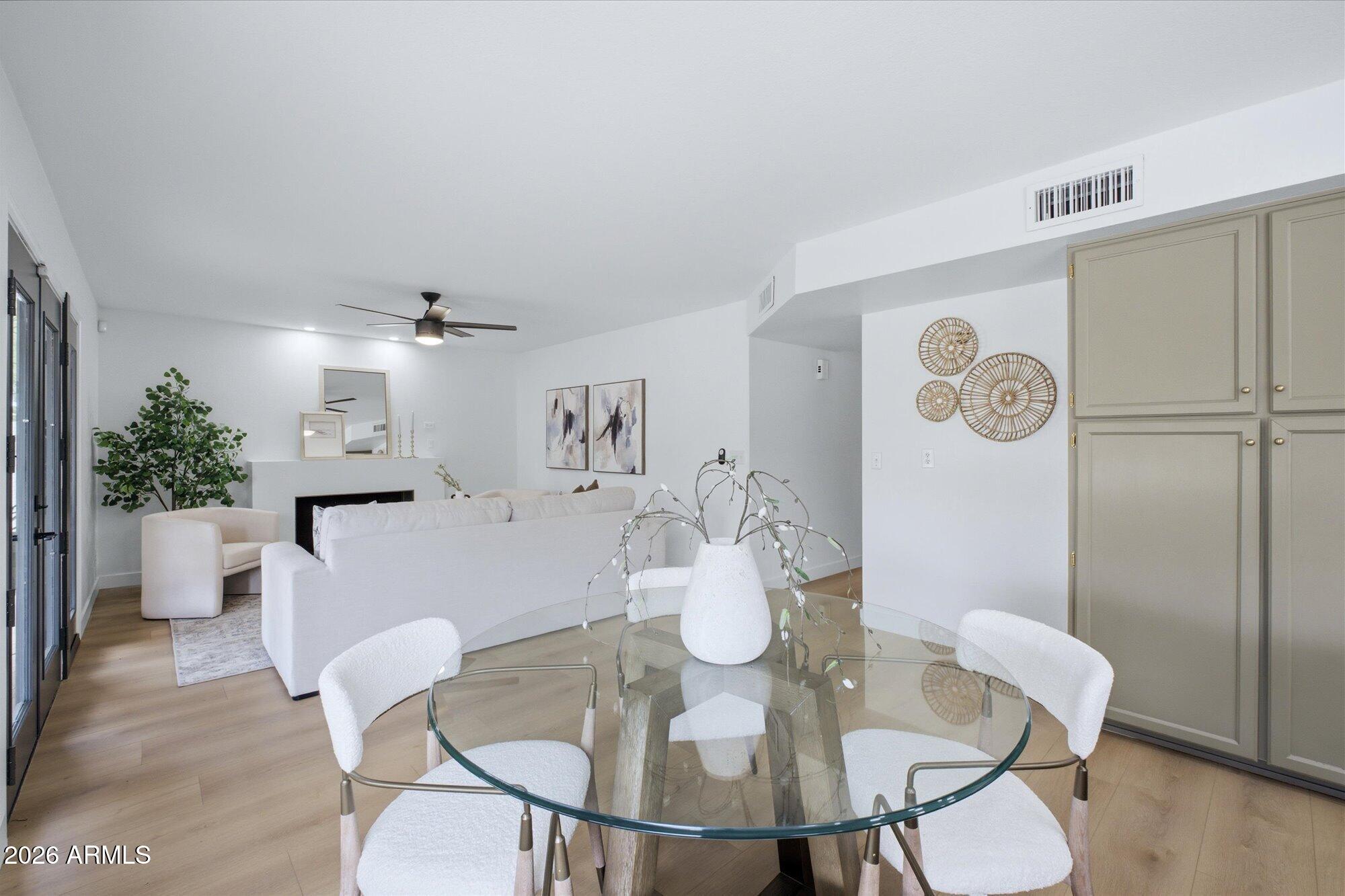 405 East Marny Road Tempe, AZ 85288 - Photo 12 of 36 a view of a dining room with furniture and wooden floor