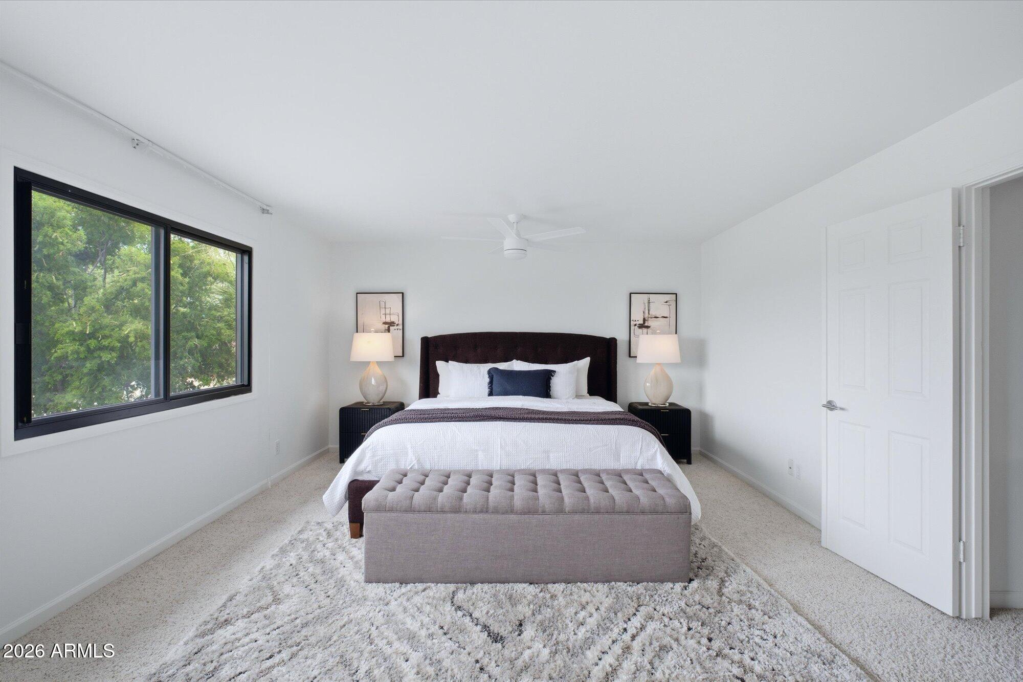 405 East Marny Road Tempe, AZ 85288 - Photo 18 of 36 a bedroom with a large bed and a large window
