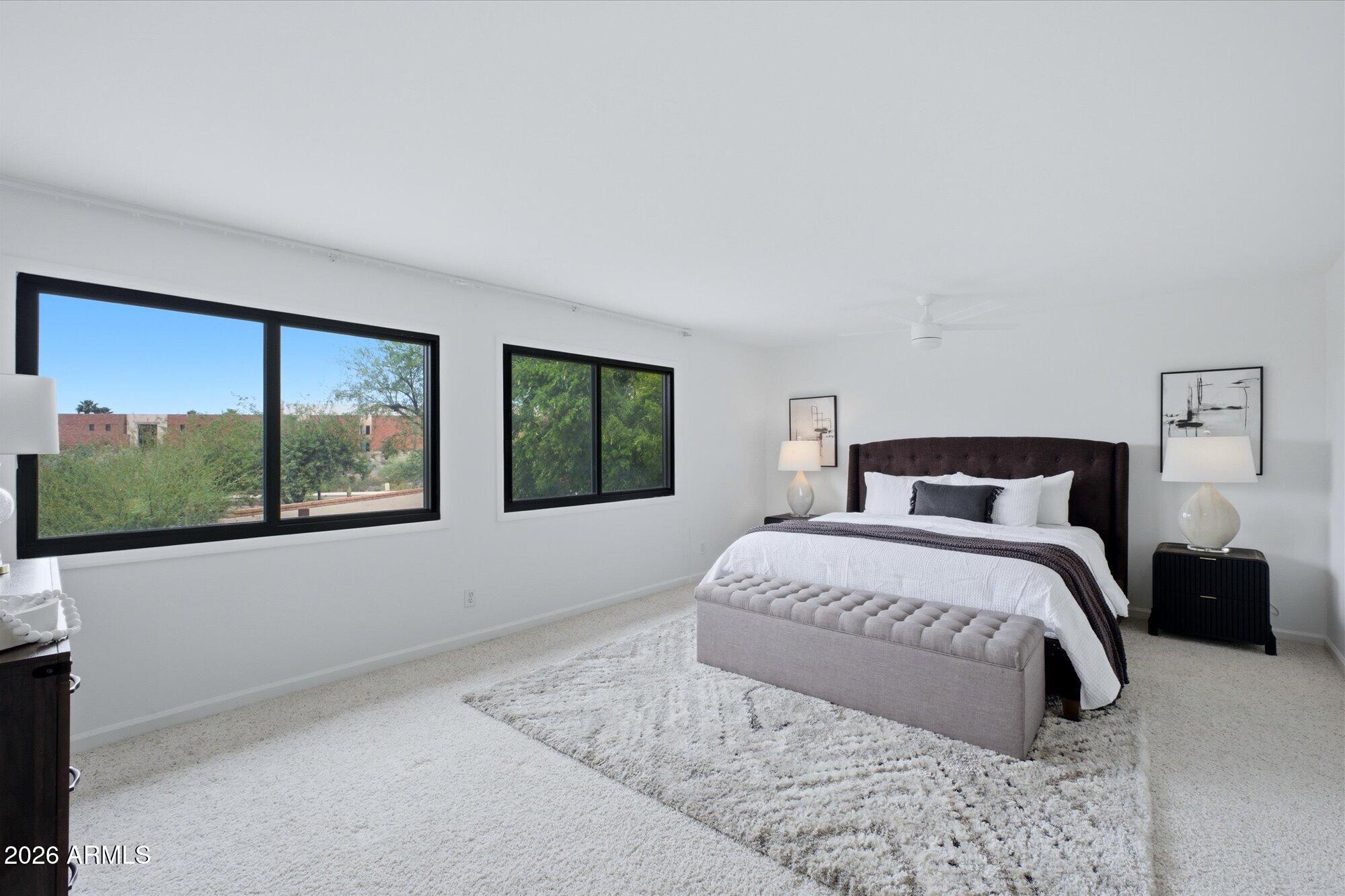 405 East Marny Road Tempe, AZ 85288 - Photo 19 of 36 a bedroom with a large bed and a window