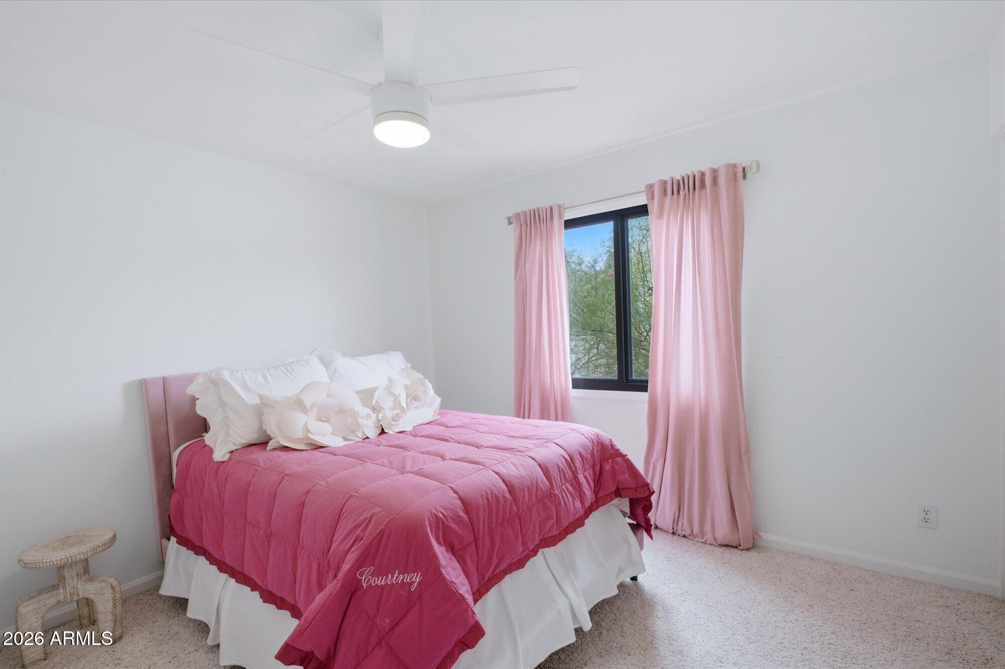 405 East Marny Road Tempe, AZ 85288 - Photo 22 of 36 a bed sitting in a bedroom next to a window