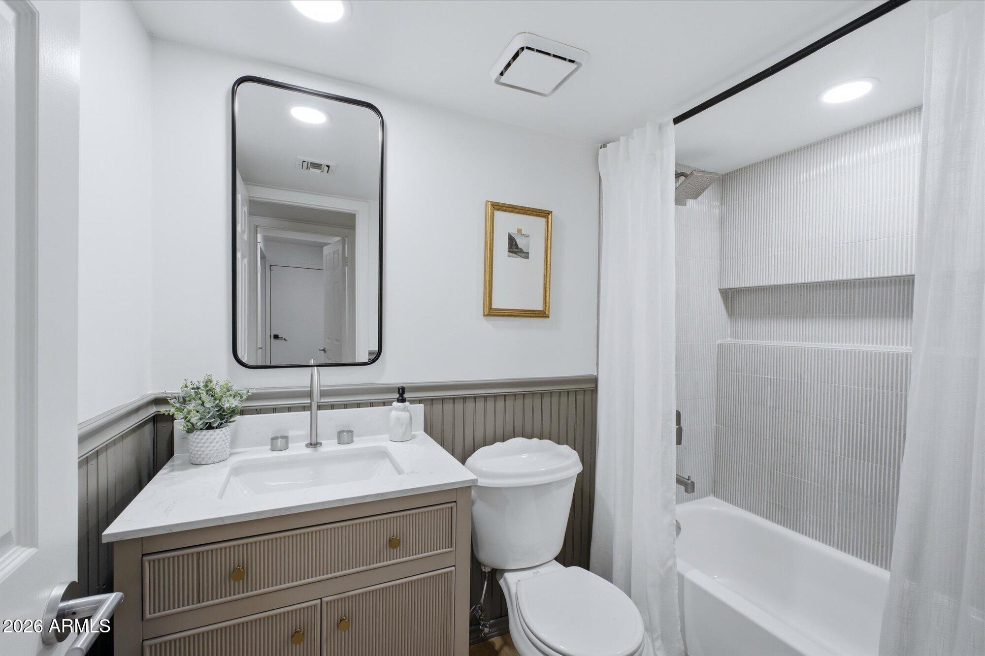 405 East Marny Road Tempe, AZ 85288 - Photo 25 of 36 a bathroom with a sink toilet and shower