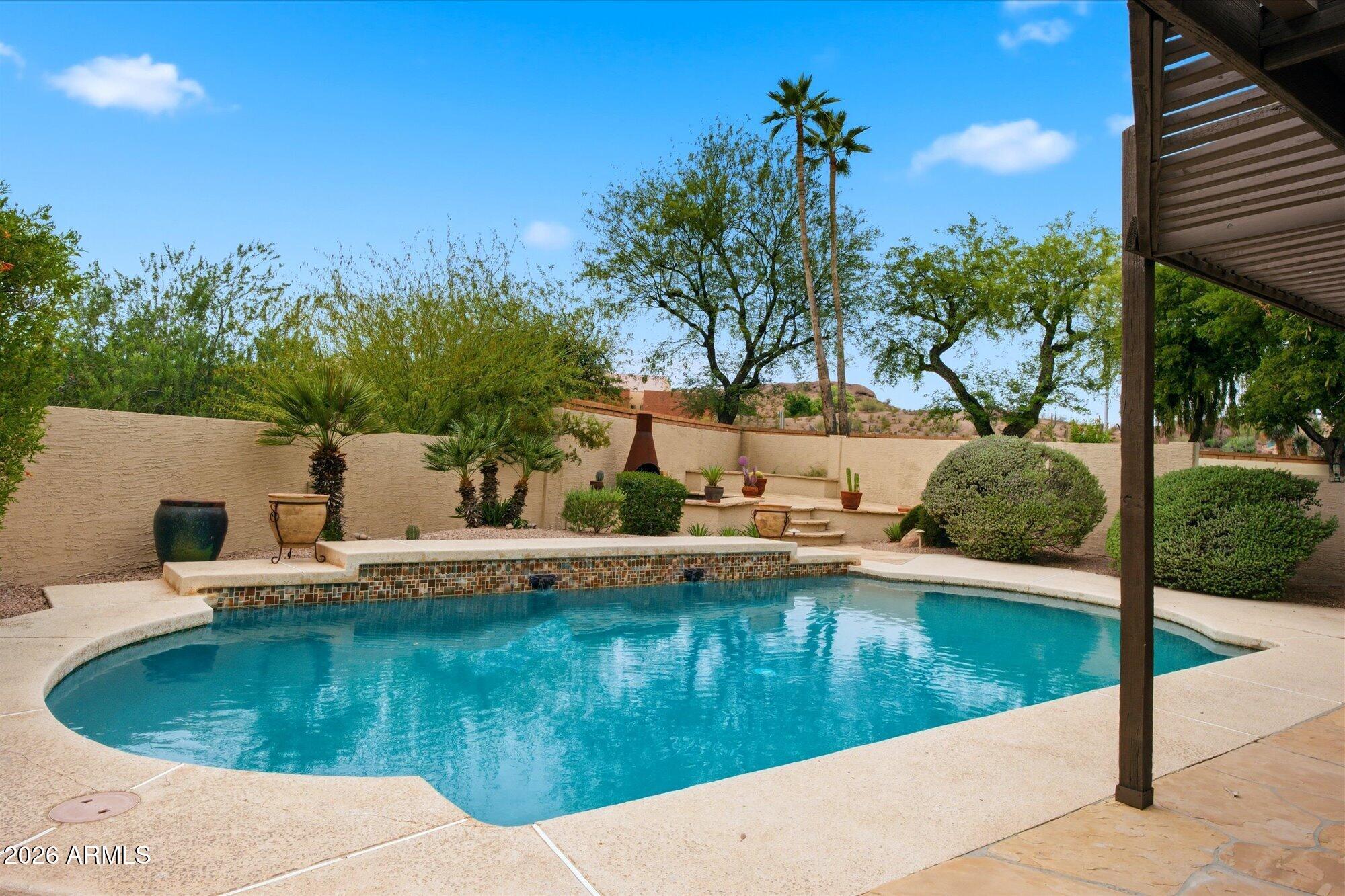 405 East Marny Road Tempe, AZ 85288 - Photo 32 of 36 a view of a swimming pool with a yard
