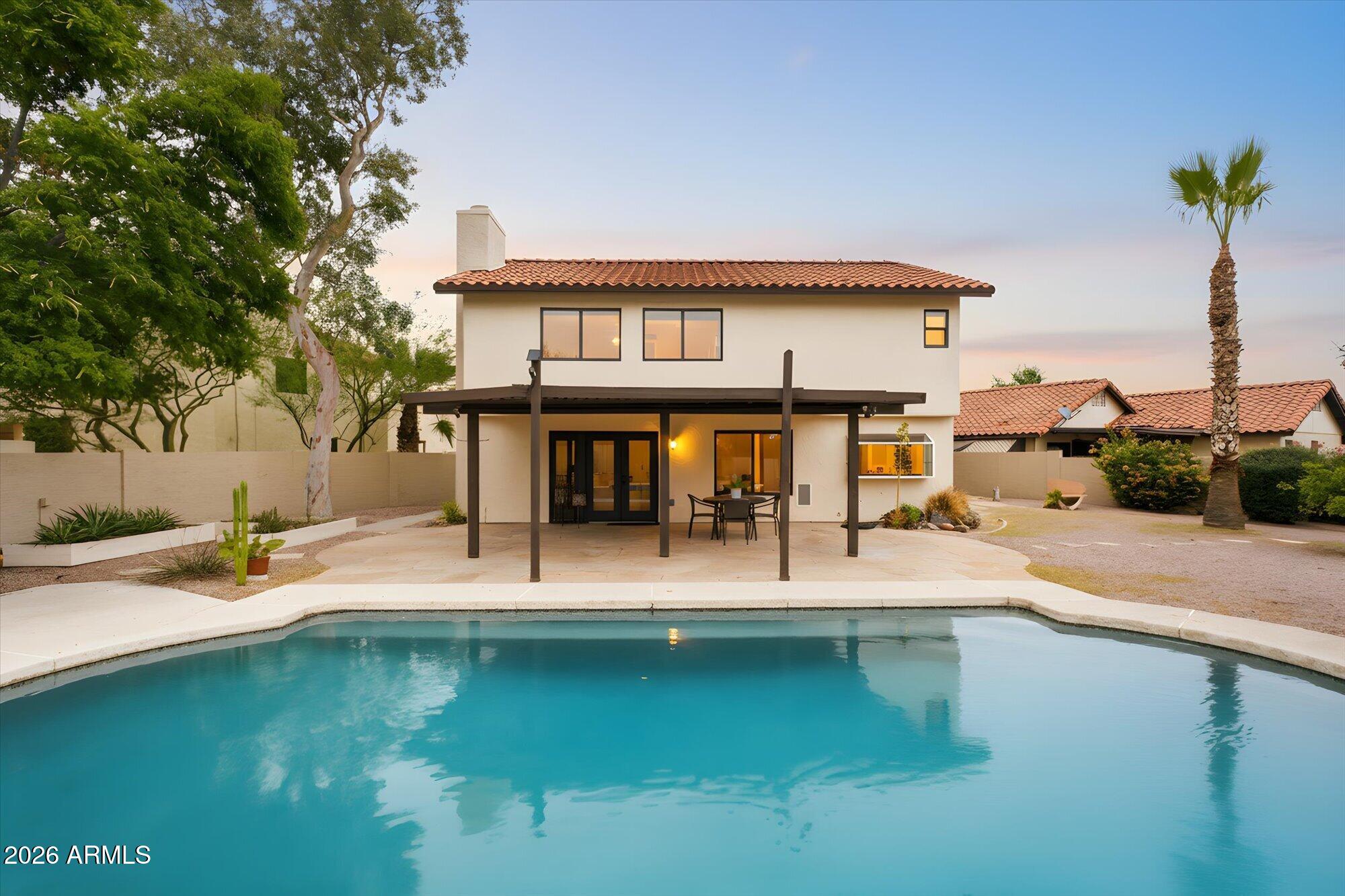 405 East Marny Road Tempe, AZ 85288 - Photo 34 of 36 a view of a swimming pool with seating space