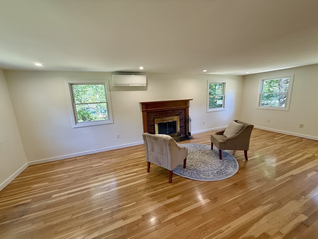 1 Maureen Road Lexington, MA 02420 - Photo 15 of 20 a living room with furniture and a fireplace