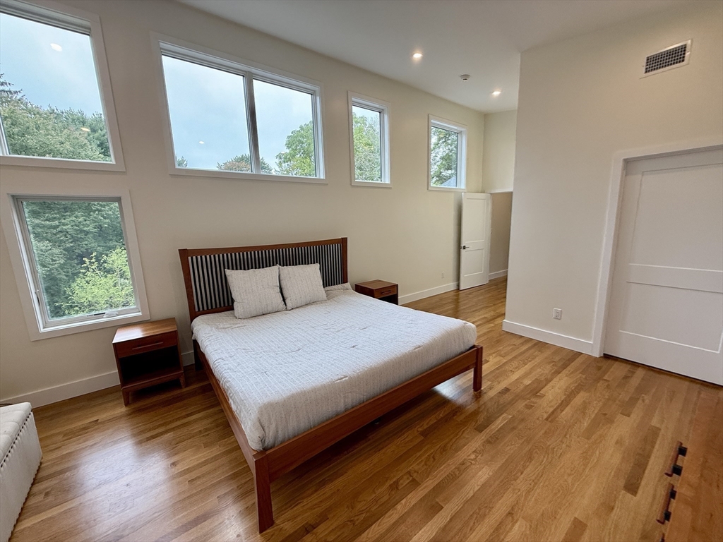 1 Maureen Road Lexington, MA 02420 - Photo 4 of 20 a bedroom with a bed and wooden floor