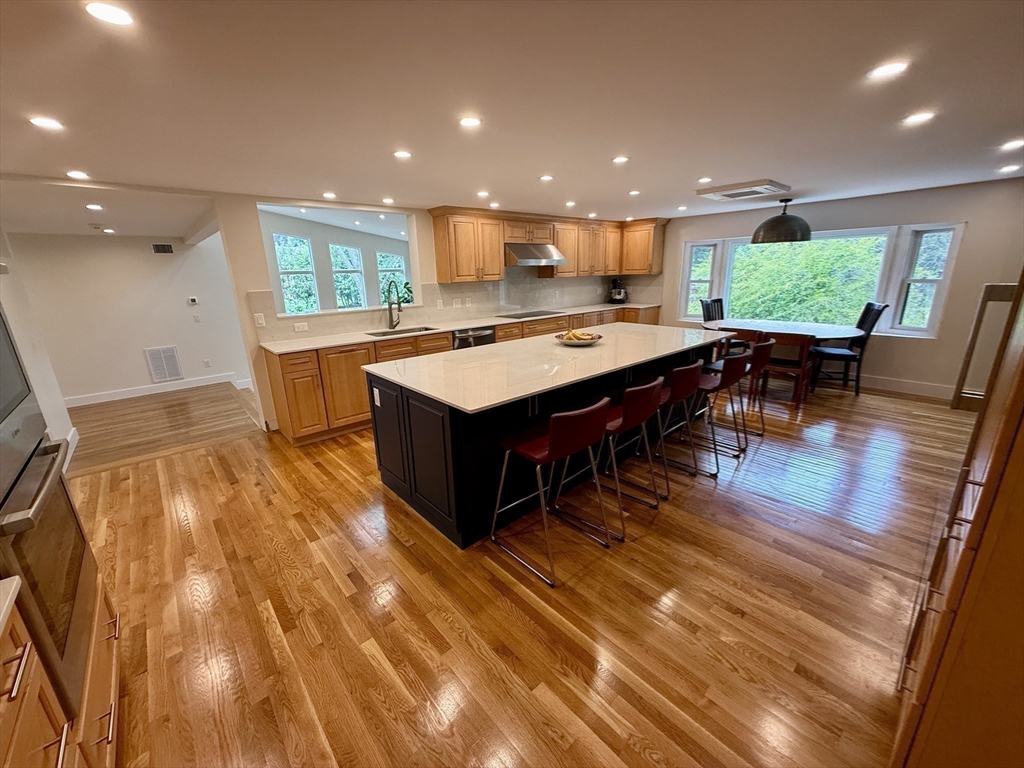 1 Maureen Road Lexington, MA 02420 - Photo 7 of 20 a large kitchen with a table and chairs