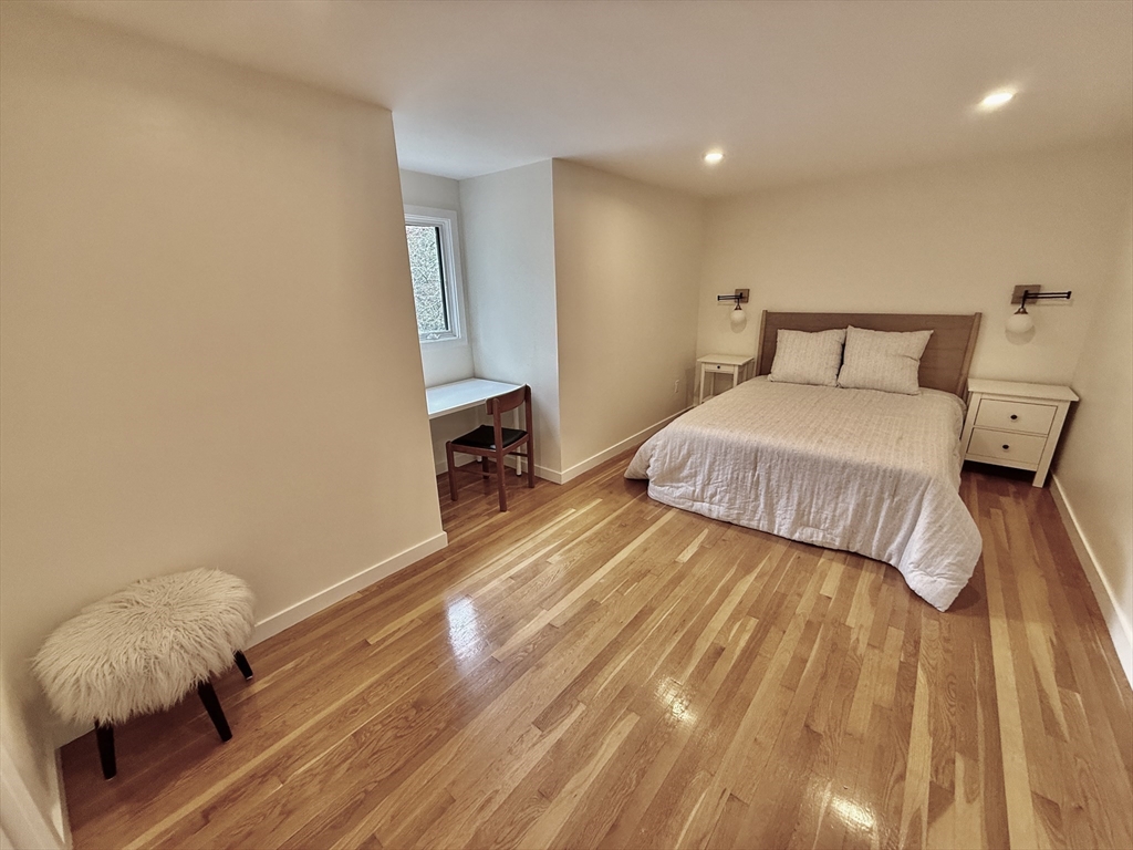 1 Maureen Road Lexington, MA 02420 - Photo 10 of 20 a bedroom with a bed and a mirror