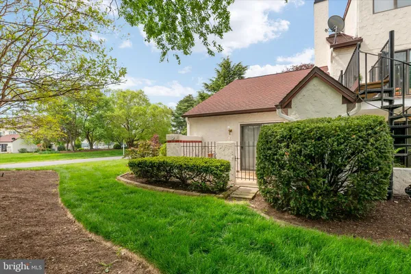 a front view of house with garden