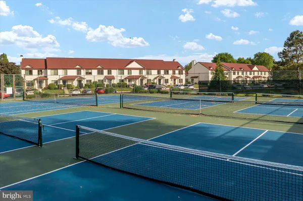 a view of an outdoor space and tennis court