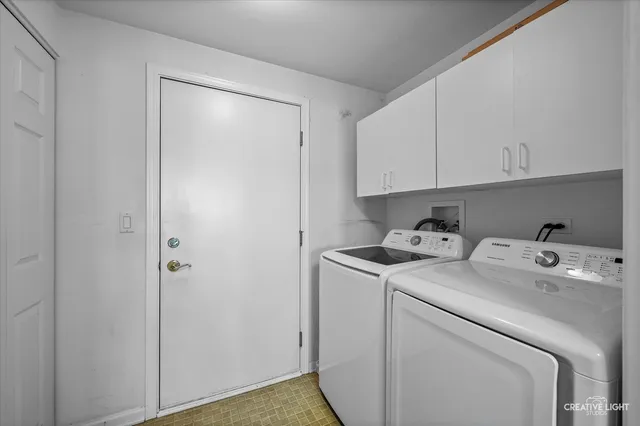a view of storage and utility room with washer and dryer