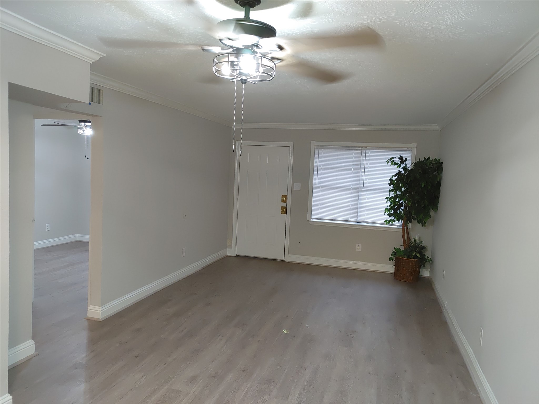 6204 Culberson Street, Unit 12 Houston, TX 77021 - Photo 5 of 6 wooden floor in an empty room with a window