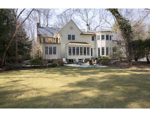 220 Ridgeway Road Weston, MA 02493 - Photo 2 of 12 a front view of a house with a swimming pool