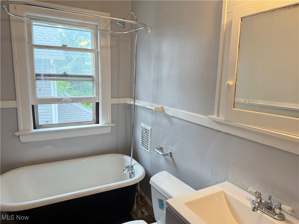 417 Arbor Road Cleveland, OH 44108 - Photo 10 of 20 Bathroom featuring a freestanding bath and vanity