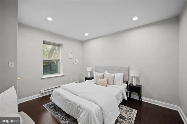 a bedroom with a bed and a table