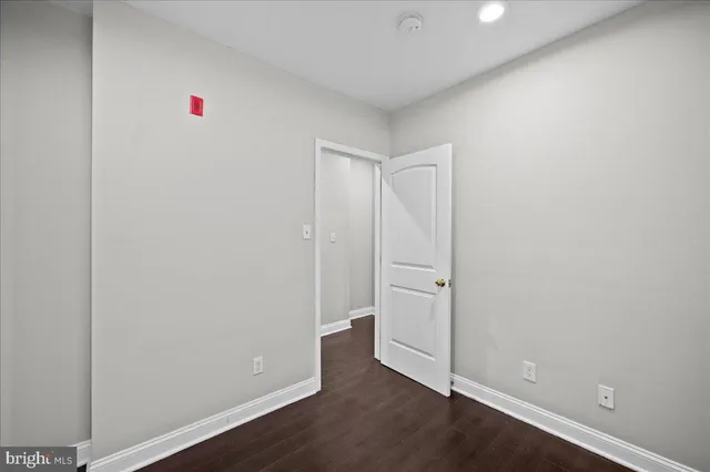 an empty room with wooden floor