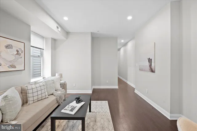 a living room with furniture and a table